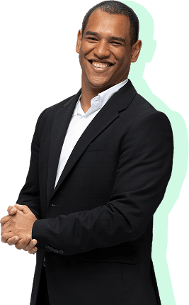 Professional man in a suit, smiling with hands clasped